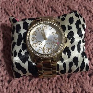 Betsy Johnson Gold bezeled watch.